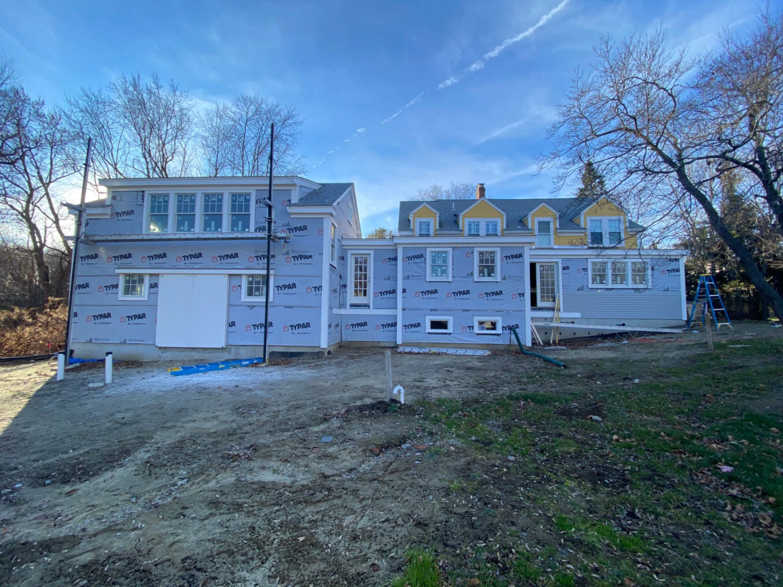 Siding contractor crew working on a Greater Boston home exterior