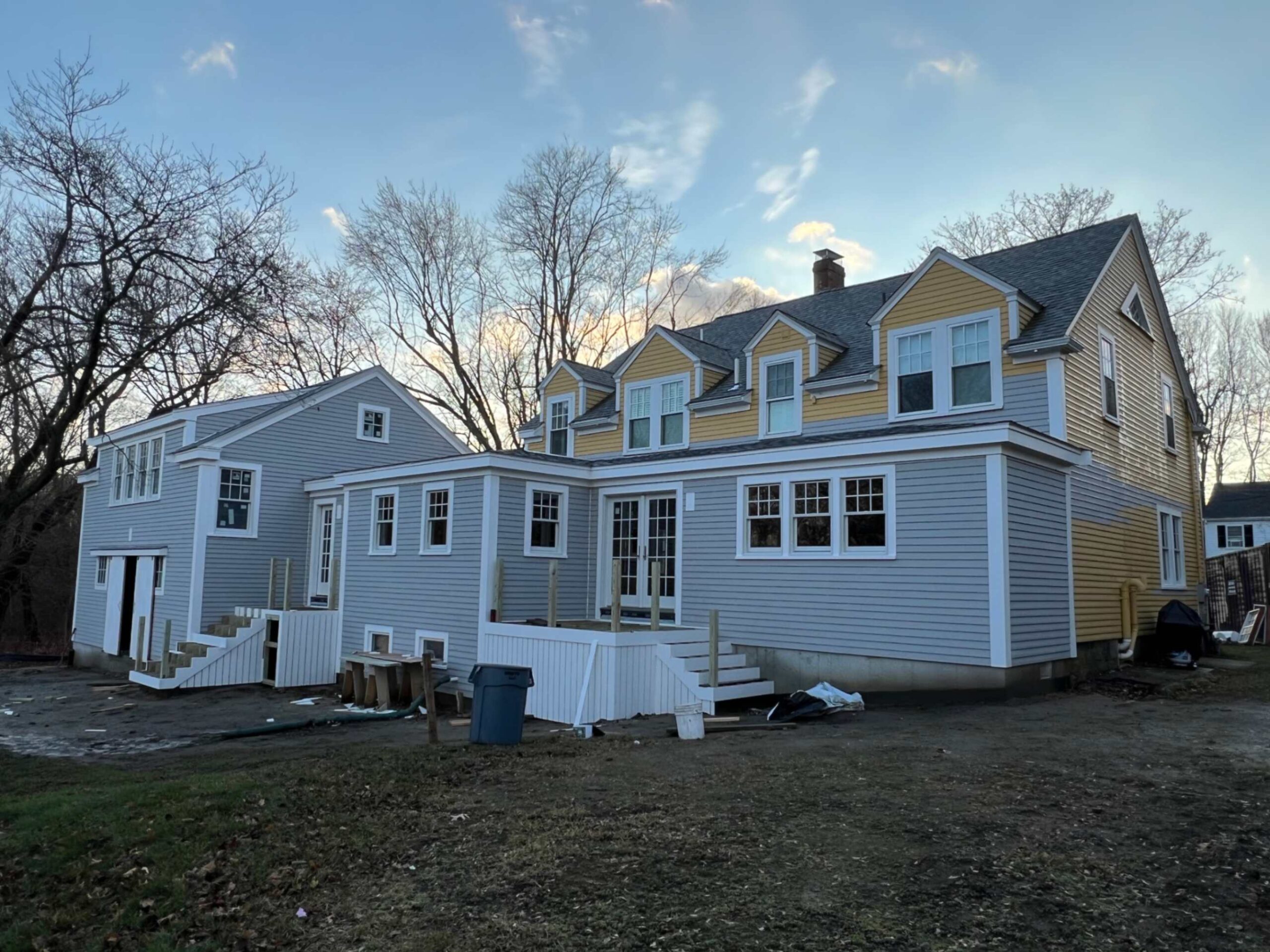 Roost Roofing and Siding crew installing energy-efficient windows in Needham, MA